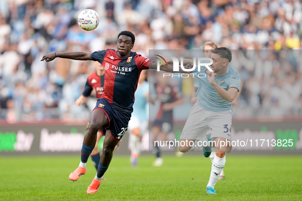 Jeff Ekhator of Genoa CFC and Mario Gila of SS Lazio compete for the ball during the Serie A Enilive match between SS Lazio and Genoa CF at...