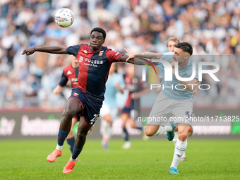 Jeff Ekhator of Genoa CFC and Mario Gila of SS Lazio compete for the ball during the Serie A Enilive match between SS Lazio and Genoa CF at...