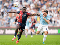 Jeff Ekhator of Genoa CFC and Mario Gila of SS Lazio compete for the ball during the Serie A Enilive match between SS Lazio and Genoa CF at...