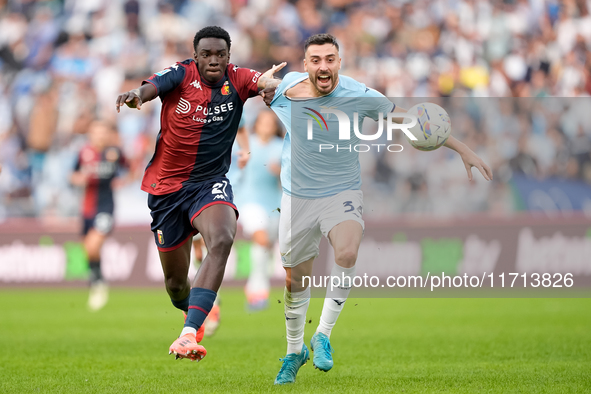 Jeff Ekhator of Genoa CFC and Mario Gila of SS Lazio compete for the ball during the Serie A Enilive match between SS Lazio and Genoa CF at...