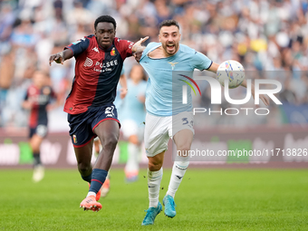 Jeff Ekhator of Genoa CFC and Mario Gila of SS Lazio compete for the ball during the Serie A Enilive match between SS Lazio and Genoa CF at...