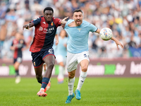 Jeff Ekhator of Genoa CFC and Mario Gila of SS Lazio compete for the ball during the Serie A Enilive match between SS Lazio and Genoa CF at...