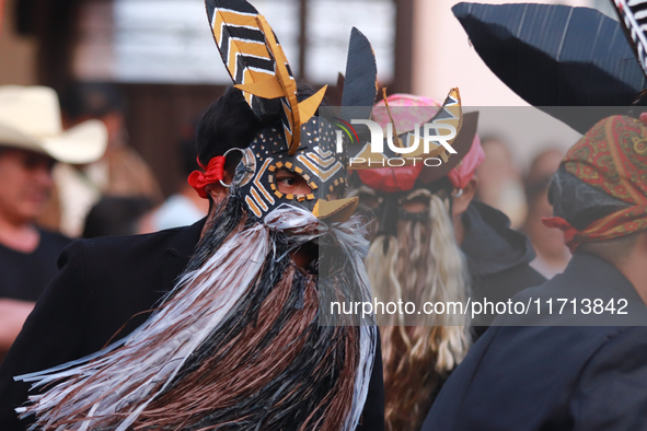 A person participates in the ''Tecuan Tlaloc'' exhibition, a project of The Jaen Cartoneria collective, to honor the God Tlaloc and pay trib...