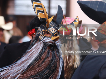 A person participates in the ''Tecuan Tlaloc'' exhibition, a project of The Jaen Cartoneria collective, to honor the God Tlaloc and pay trib...