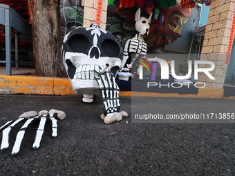 Cardboard skulls are seen during the ''Tecuan Tlaloc'' exhibition, a project of The Jaen Cartoneria collective, in honor of the God Tlaloc a...