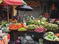 Vendors sell vegetables inside a market in Kolkata, India, on October 27, 2024. (