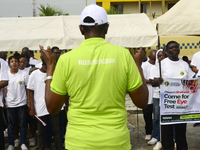 Officials and trainees of the Vocational Training Centre, Federal Nigeria Society for the Blind, Oshodi, participate in a sensitization walk...