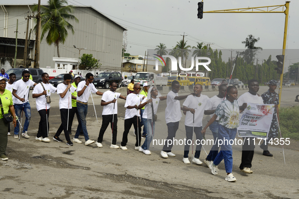 Officials and trainees of the Vocational Training Centre, Federal Nigeria Society for the Blind, Oshodi, participate in a sensitization walk...