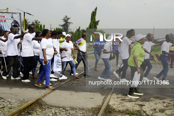 Officials and trainees of the Vocational Training Centre, Federal Nigeria Society for the Blind, Oshodi, participate in a sensitization walk...