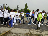 Officials and trainees of the Vocational Training Centre, Federal Nigeria Society for the Blind, Oshodi, participate in a sensitization walk...