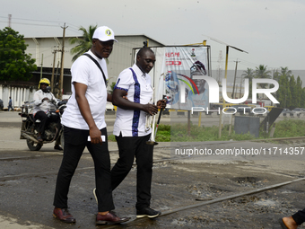 Officials and trainees of the Vocational Training Centre, Federal Nigeria Society for the Blind, Oshodi, participate in a sensitization walk...