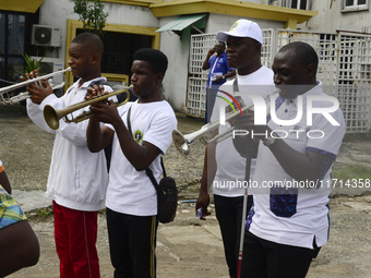 Officials and trainees of the Vocational Training Centre, Federal Nigeria Society for the Blind, Oshodi, participate in a sensitization walk...