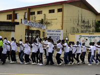 Officials and trainees of the Vocational Training Centre, Federal Nigeria Society for the Blind, Oshodi, participate in a sensitization walk...