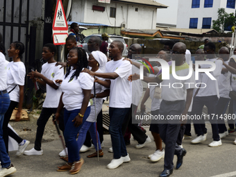 Officials and trainees of the Vocational Training Centre, Federal Nigeria Society for the Blind, Oshodi, participate in a sensitization walk...