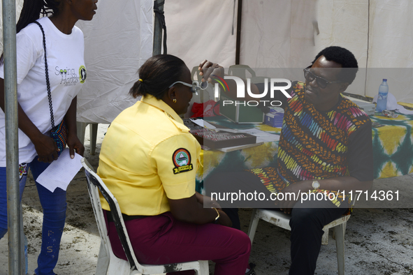 A Lagos State traffic official undergoes eye screening as the Federal Nigeria Society for the Blind organizes a walk and conducts free eye s...