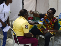 A Lagos State traffic official undergoes eye screening as the Federal Nigeria Society for the Blind organizes a walk and conducts free eye s...