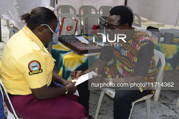 A Lagos State traffic official undergoes eye screening as the Federal Nigeria Society for the Blind organizes a walk and conducts free eye s...