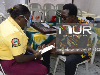 A Lagos State traffic official undergoes eye screening as the Federal Nigeria Society for the Blind organizes a walk and conducts free eye s...