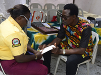 A Lagos State traffic official undergoes eye screening as the Federal Nigeria Society for the Blind organizes a walk and conducts free eye s...