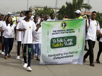 Officials and trainees of the Vocational Training Centre, Federal Nigeria Society for the Blind, Oshodi, participate in a sensitization walk...