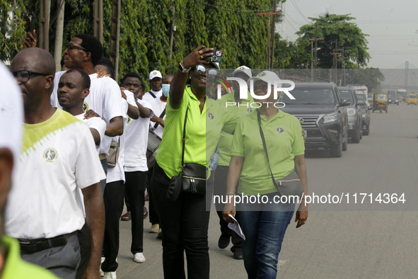 Officials and trainees of the Vocational Training Centre, Federal Nigeria Society for the Blind, Oshodi, participate in a sensitization walk...