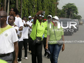 Officials and trainees of the Vocational Training Centre, Federal Nigeria Society for the Blind, Oshodi, participate in a sensitization walk...