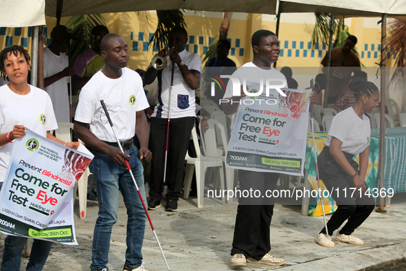 Officials and trainees of the Vocational Training Centre, Federal Nigeria Society for the Blind, Oshodi, participate in a sensitization walk...