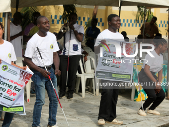 Officials and trainees of the Vocational Training Centre, Federal Nigeria Society for the Blind, Oshodi, participate in a sensitization walk...