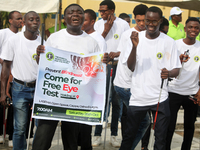 Officials and trainees of the Vocational Training Centre, Federal Nigeria Society for the Blind, Oshodi, participate in a sensitization walk...