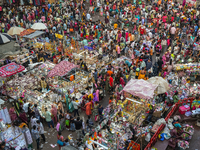 Over a thousand people buy new clothes, home decor, and other accessories in the old market as they throng the shopping hub before the bigge...