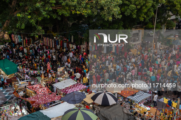 Over a thousand people buy new clothes, home decor, and other accessories in the old market as they throng the shopping hub before the bigge...