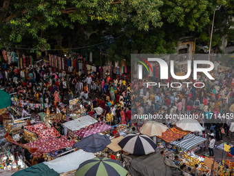 Over a thousand people buy new clothes, home decor, and other accessories in the old market as they throng the shopping hub before the bigge...