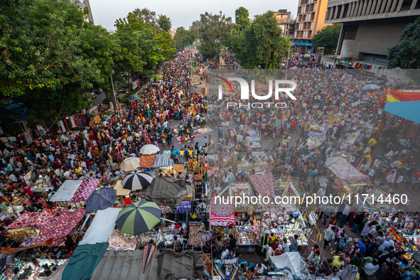 Over a thousand people buy new clothes, home decor, and other accessories in the old market as they throng the shopping hub before the bigge...