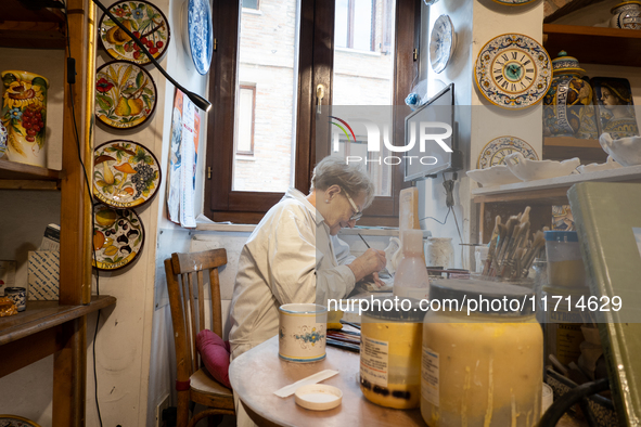 An artisan decorating ceramic object is seen in Deruta, Italy, on October 22nd, 2024. Deruta is the city par excellence of the artistic majo...