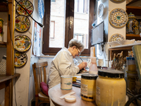 An artisan decorating ceramic object is seen in Deruta, Italy, on October 22nd, 2024. Deruta is the city par excellence of the artistic majo...