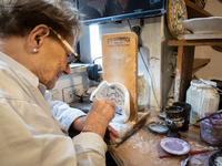 An artisan decorating ceramic object is seen in Deruta, Italy, on October 22nd, 2024. Deruta is the city par excellence of the artistic majo...