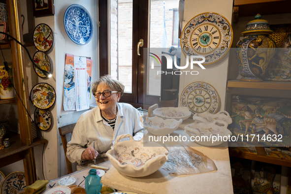 An artisan decorating ceramic object is seen in Deruta, Italy, on October 22nd, 2024. Deruta is the city par excellence of the artistic majo...