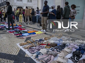 Street vendors sell diverse kinds of goods on one of the streets in the Baixa district in Lisbon, Portugal, on October 27, 2024. (