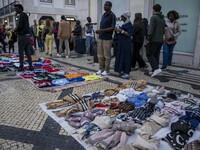 Street vendors sell diverse kinds of goods on one of the streets in the Baixa district in Lisbon, Portugal, on October 27, 2024. (