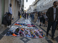 Street vendors sell diverse kinds of goods on one of the streets in the Baixa district in Lisbon, Portugal, on October 27, 2024. (