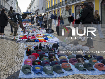 Street vendors sell diverse kinds of goods on one of the streets in the Baixa district in Lisbon, Portugal, on October 27, 2024. (