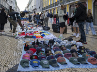 Street vendors sell diverse kinds of goods on one of the streets in the Baixa district in Lisbon, Portugal, on October 27, 2024. (