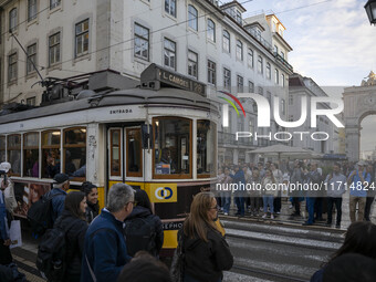 A tram moves through one of the streets of the Baixa district in Lisbon, Portugal, on October 27, 2024. (