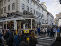 A tram moves through one of the streets of the Baixa district in Lisbon, Portugal, on October 27, 2024. (