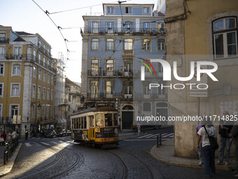 A tram moves through one of the streets of the Baixa district in Lisbon, Portugal, on October 27, 2024. (