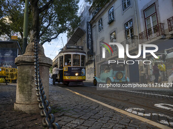 A tram moves through one of the streets of the Baixa district in Lisbon, Portugal, on October 27, 2024. (