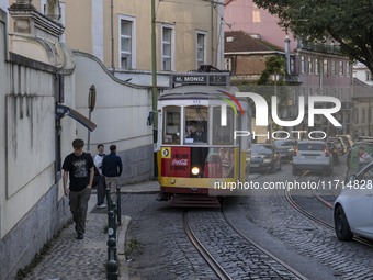 A tram moves through one of the streets of the Baixa district in Lisbon, Portugal, on October 27, 2024. (