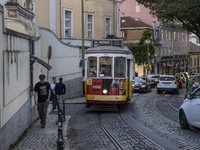 A tram moves through one of the streets of the Baixa district in Lisbon, Portugal, on October 27, 2024. (