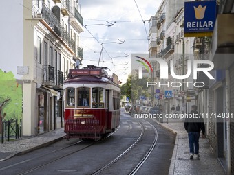 A tram moves through one of the streets of the Baixa district in Lisbon, Portugal, on October 27, 2024. (