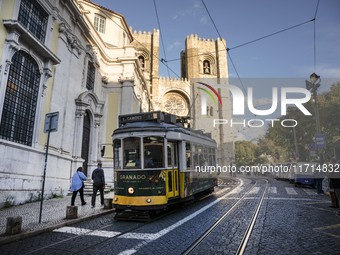 A tram moves through one of the streets of the Baixa district in Lisbon, Portugal, on October 27, 2024. (